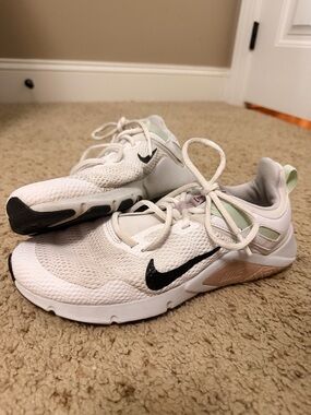 Nike White Mesh Sneakers with Black Swoosh and Pale Green Heel Tab